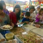 Orphan Children of different ages line up for food
